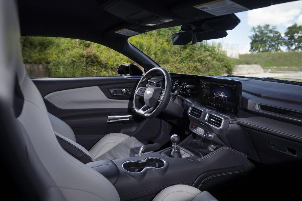 The interior of the new Mustang is the most technologically advanced, driver-centric cockpit of any Mustang to date. The fighter jet-inspired cockpit offers the driver two flowing and curved displays that can be quickly customized to show information the driver wants or needs to see. Pre-production vehicles shown