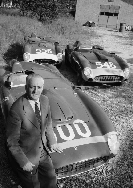 Enzo Ferrari w/ race cars